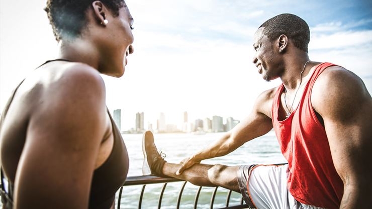 couple stretching outdoors