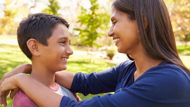 mother and son smiling