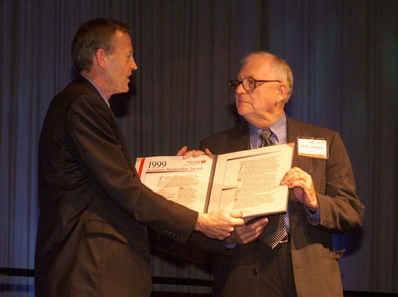 Dr. Eugene Braunwald (right) receives the Academic Mentorship Award in 1999 from then-American Heart Association President Dr. Lynn Smaha. (Photo by Todd Buchanan for the American Heart Association)