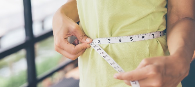 Woman measuring waist