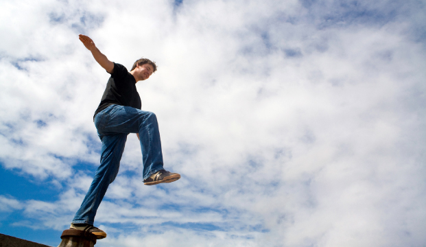 Man balancing on one leg