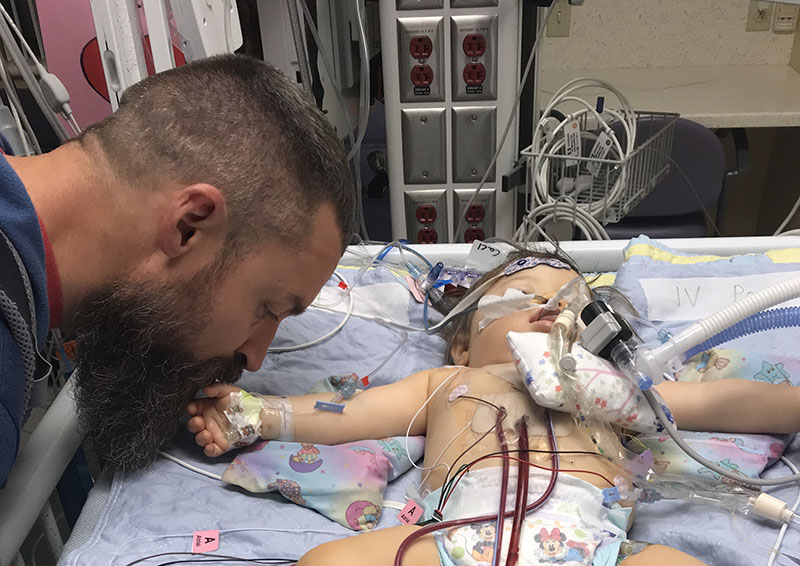 Ryan Tittsworth with Molly just after her open-heart surgery. (Photo courtesy of the Tittsworth family)