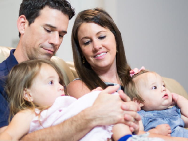 Stroke survivor Amanda Moreland (right) with her husband Tony and two daughters. (Photo by Brooks Rehabilitation)