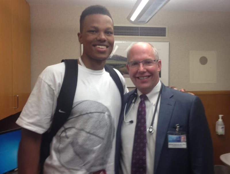 Lacey James (left) with Dr. Michael Ackerman, the cardiologist who diagnosed his heart condition. (Photo courtesy of Lacey James)