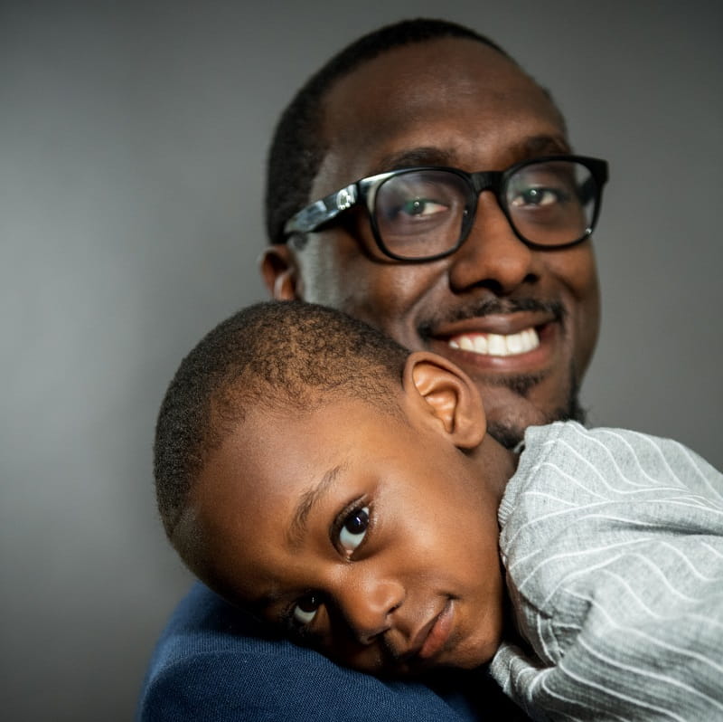 Charles Daniels, Jr. introduced his son, Clayton, to  Charles, Sr. (Photo by Liz Linder)   