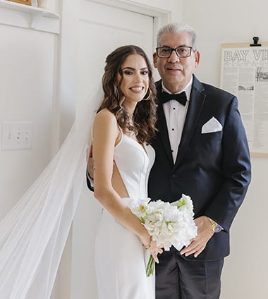 A wedding portrait of stroke survivor, Manuel Vera, and his daughter