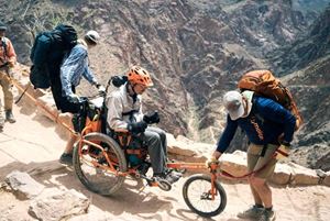 Geoff on his modified half wheelchair and half mountain bike