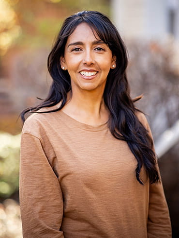 A portrait of Lucia Valdez in an outdoor setting