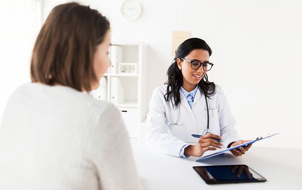 doctor reviewing chart with patient doctor reviewing chart with patient