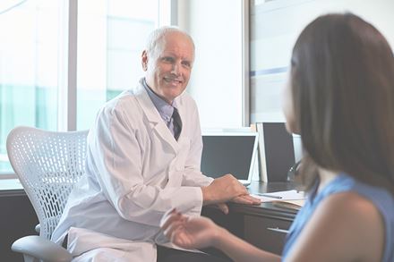 doctor consulting with female patient doctor consulting with female patient