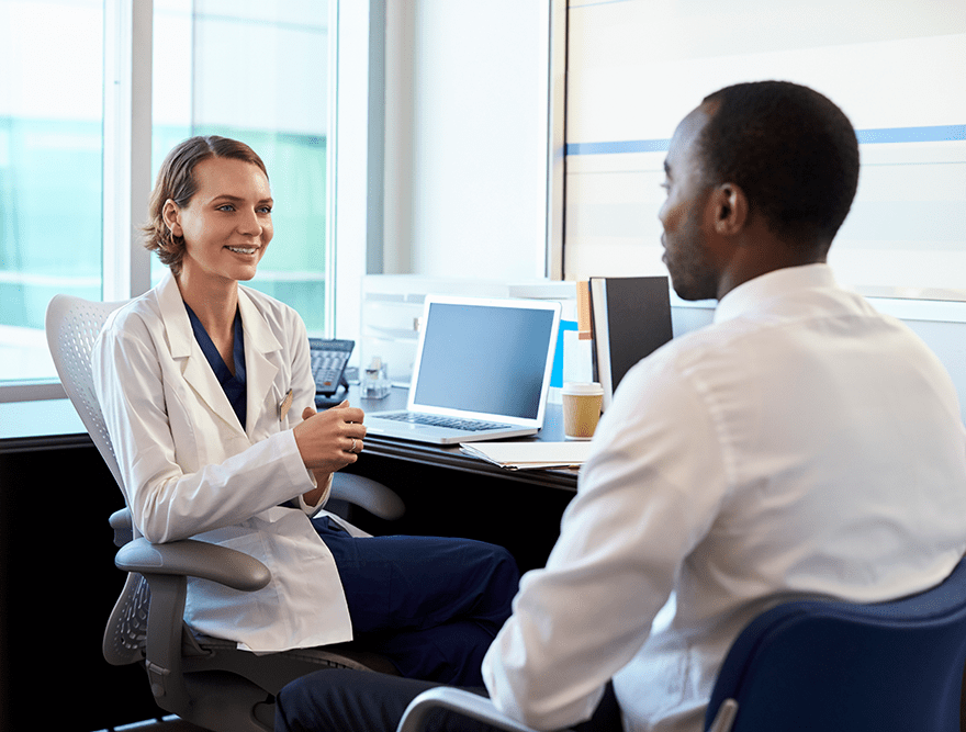 Doctor in consultation with male patient Doctor in consultation with male patient