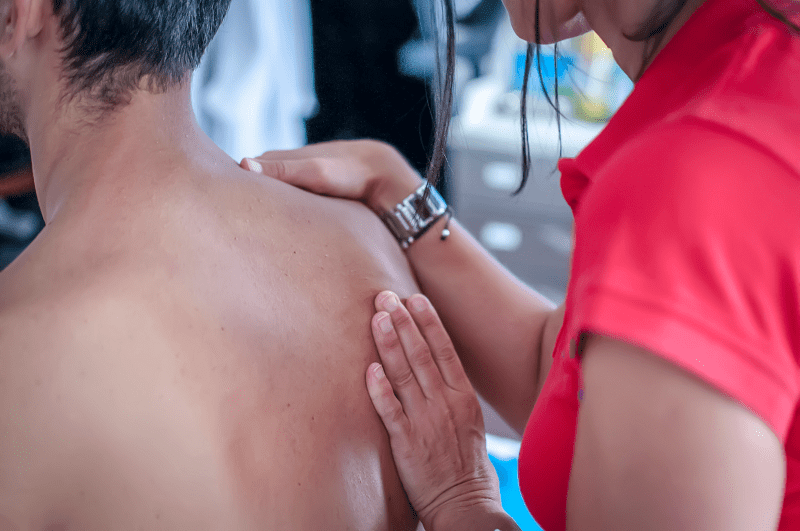 Therapist working on a patient's shoulder