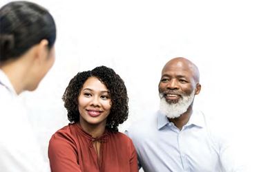 Black couple talking to a healthcare professional