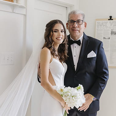 A wedding portrait of stroke survivor, Manuel Vera, and his daughter