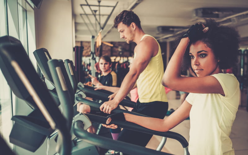 People exercising on treadmills.